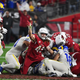 Dennis Gardeck and the Arizona Cardinals recover an onside kick Monday night against the Rams.